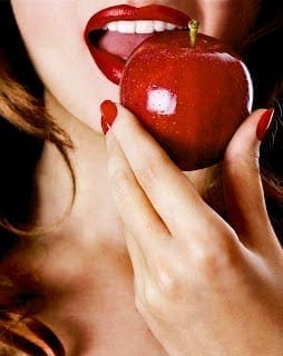 Woman eating apple