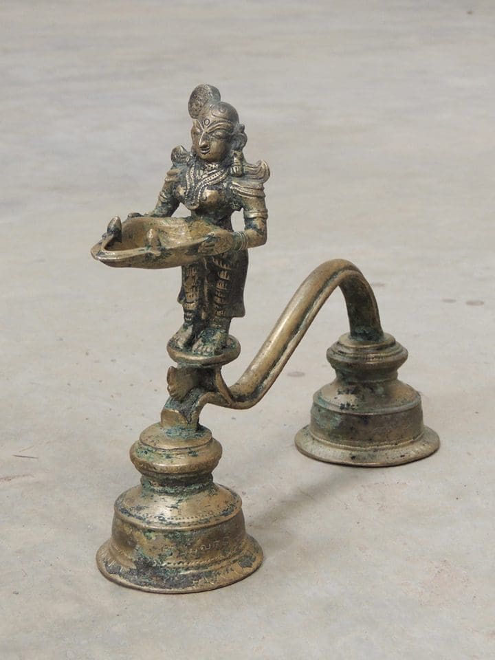 An intricate “Deepalakshmi arathi” lamp made of brass.