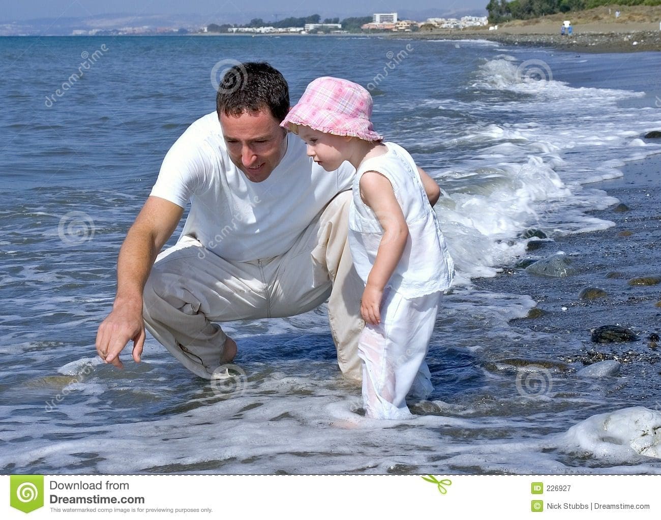 father daughter playing sea 226927