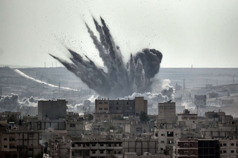 A shell explodes in Syria