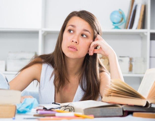 Girl writing papers