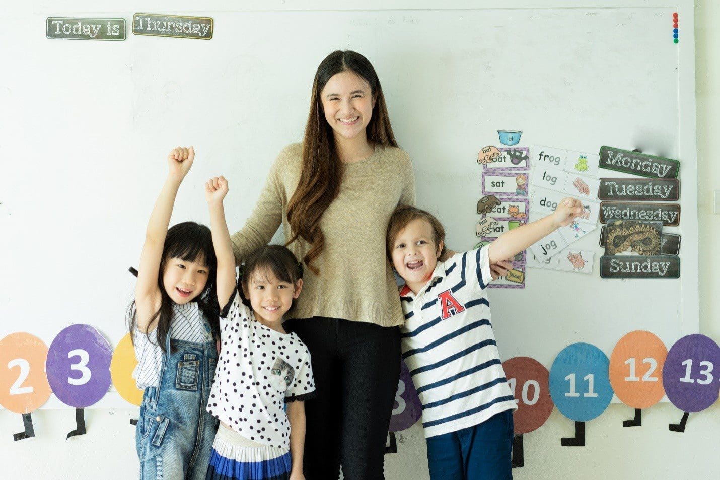 Happy school kids with teacher