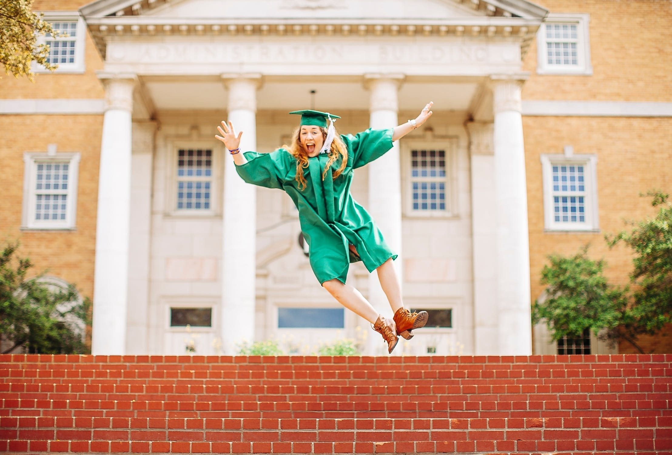College Graduate Jumping Joy