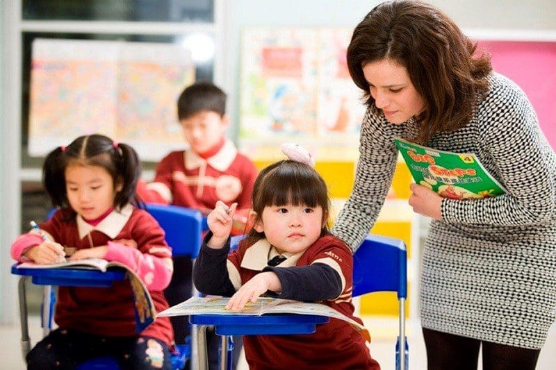 School Teacher With Asian Students