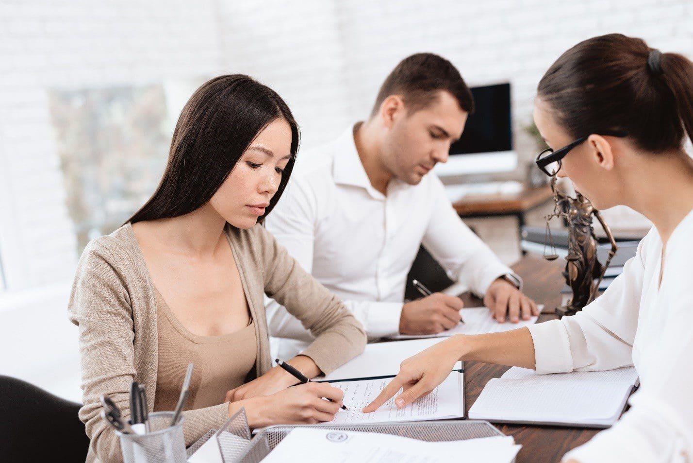 Couple Signing Papers