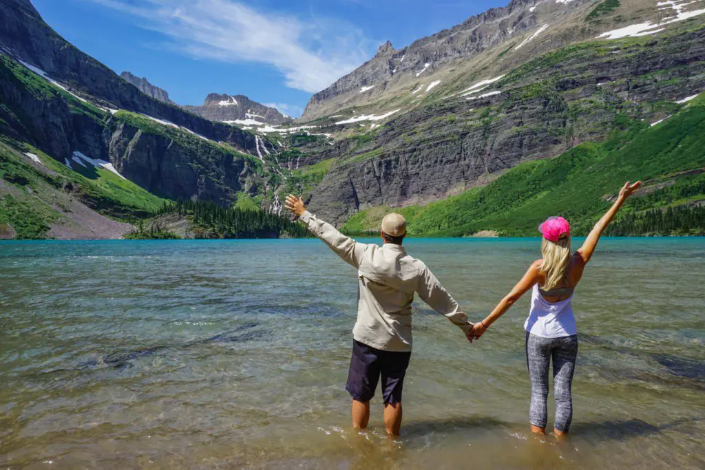 Couple Standing In River Mountains