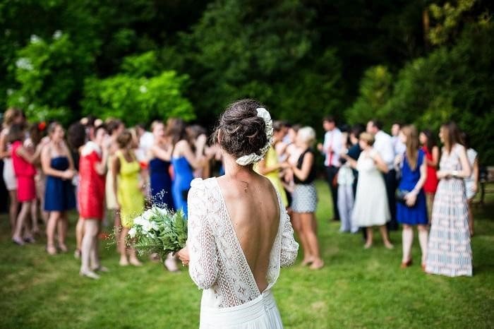 wedding guest dresses Bride With Backless Wedding Dress Bouquet