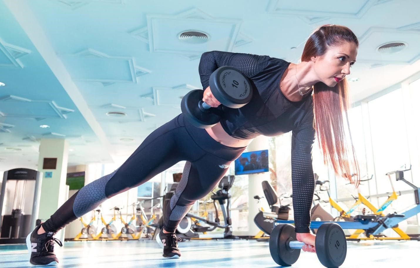 Woman doing excercise in gym Woman Doing Excercise In Gym