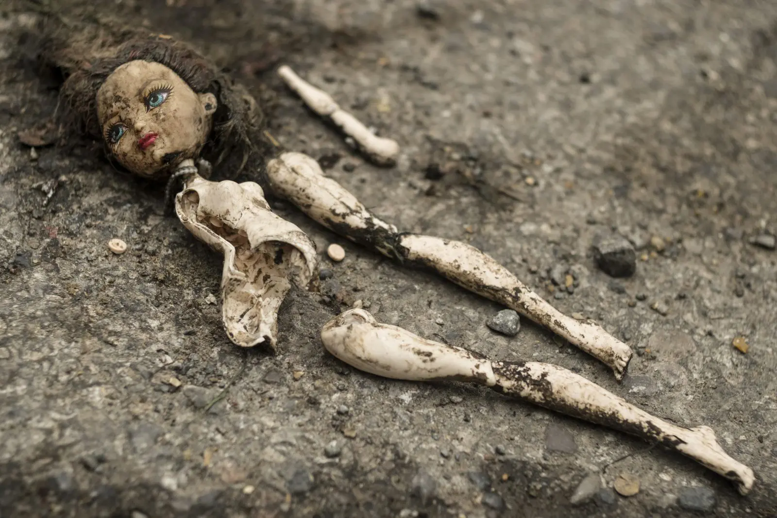 Innocence Shattered broken doll
