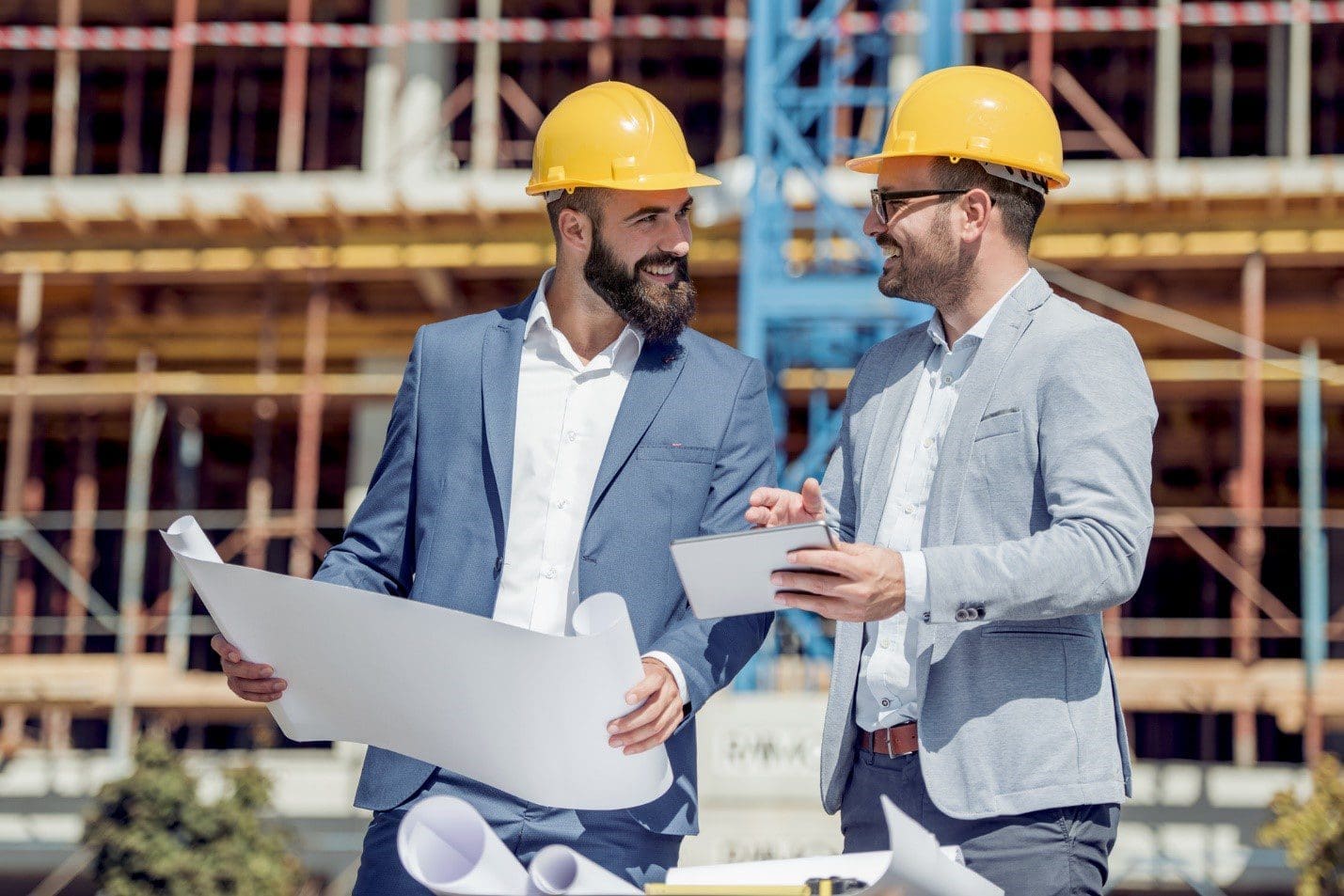 discussing construction at site Discussing Construction Business At Site