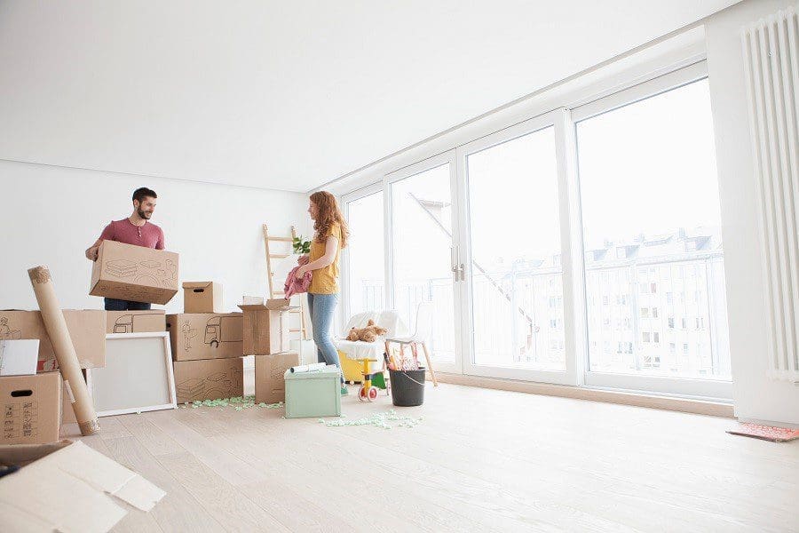 new home Man Woman Unpacking Home