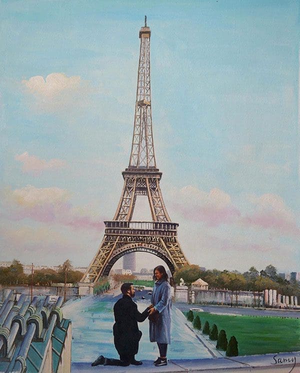 A man proposes to his significant other in front of the Eiffel Tower in Paris.