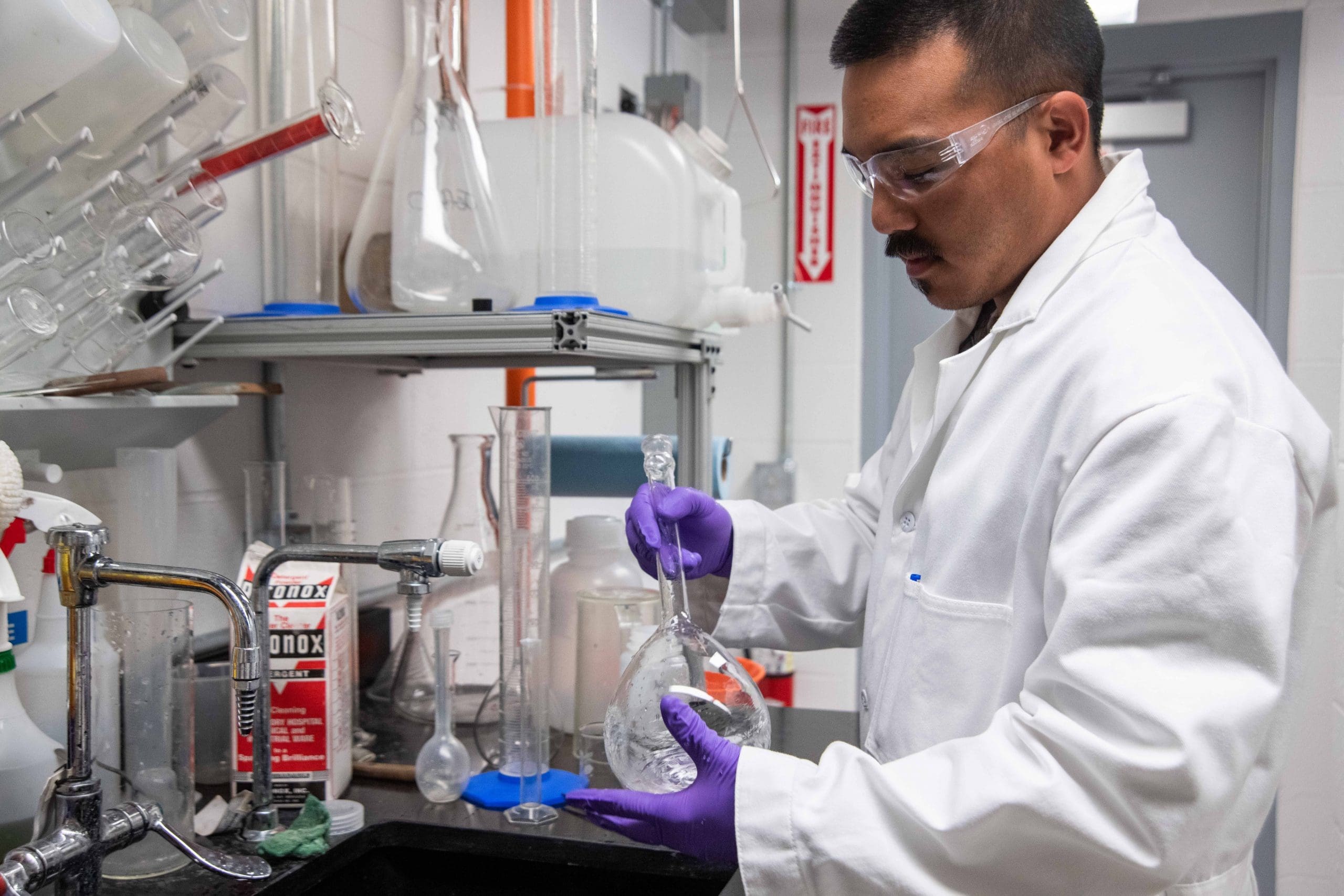 quick fix urine man mixing a flask inside a laboratory