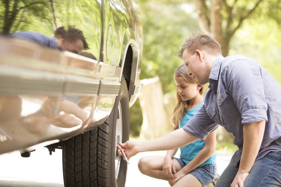 checking automobile tire pressure