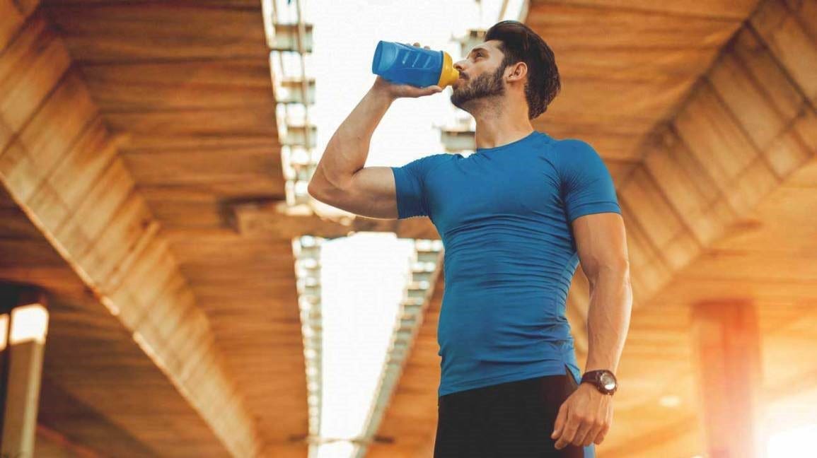 man having pre-workout drink