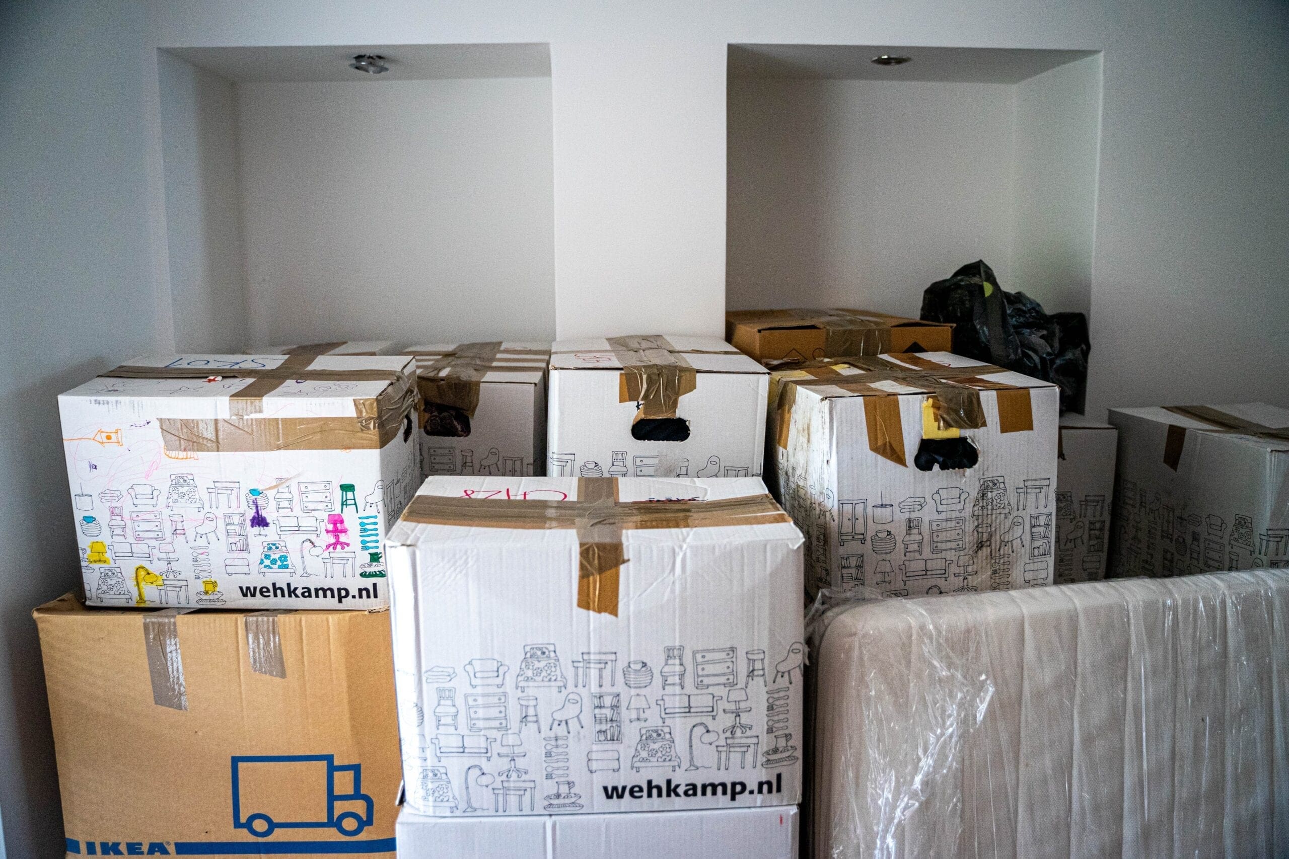 brown cardboard boxes on brown wooden table moving company