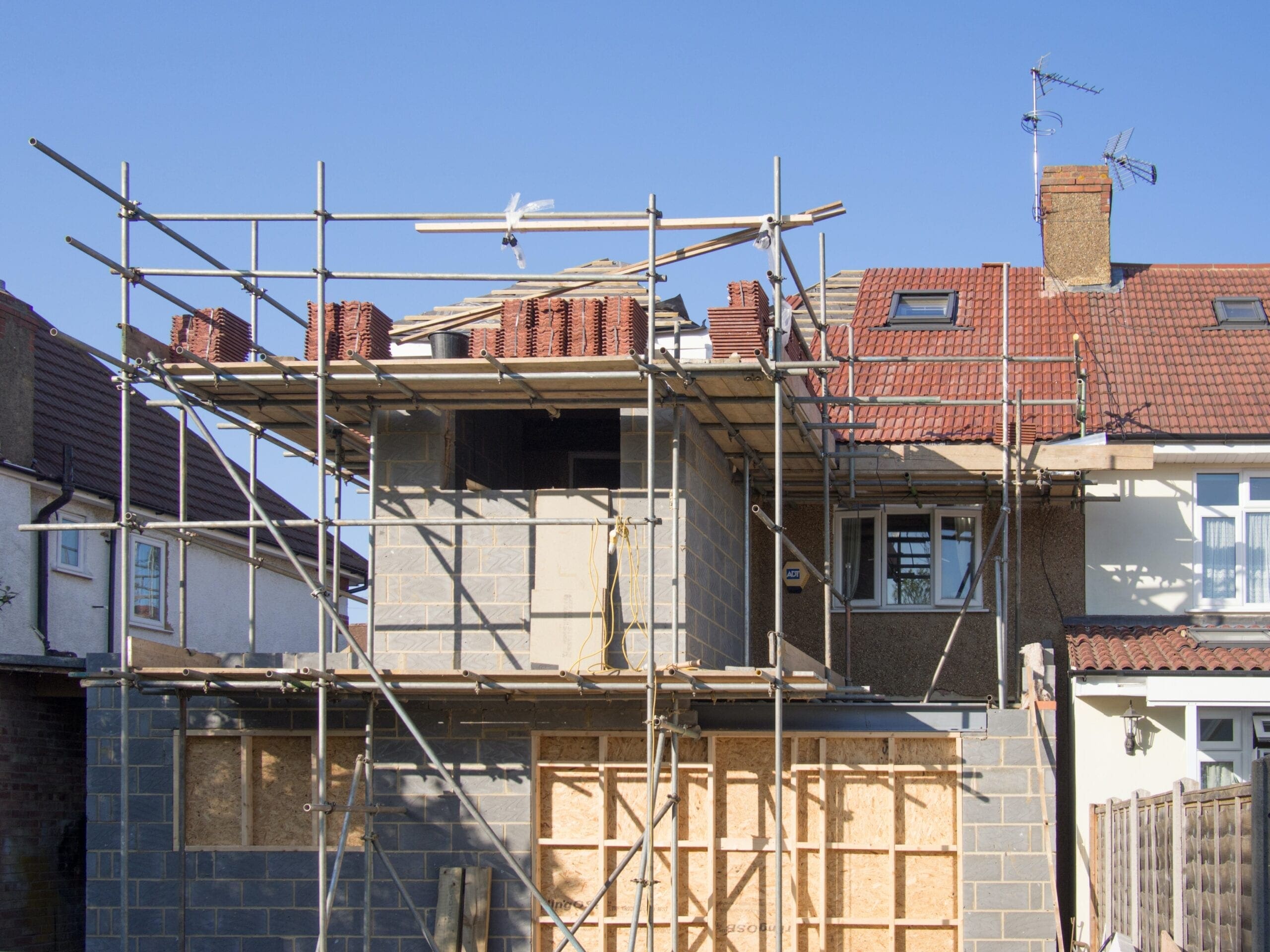 brown and white concrete building scaffolding