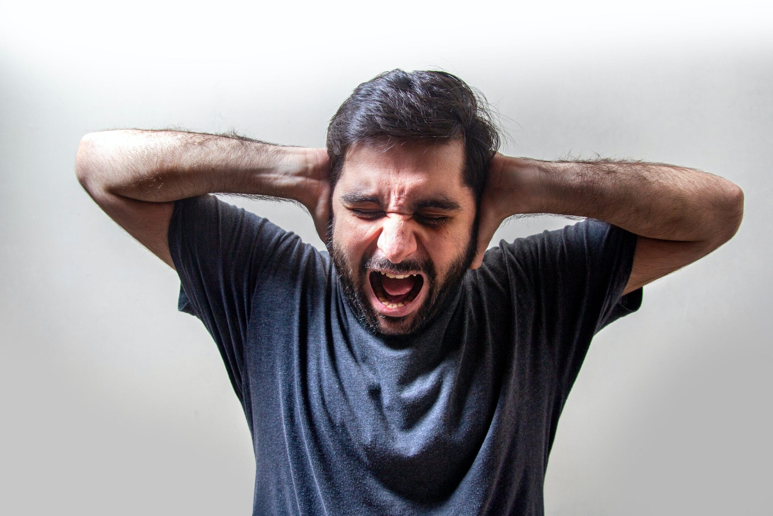 man in black crew neck t-shirt anxiety and stress