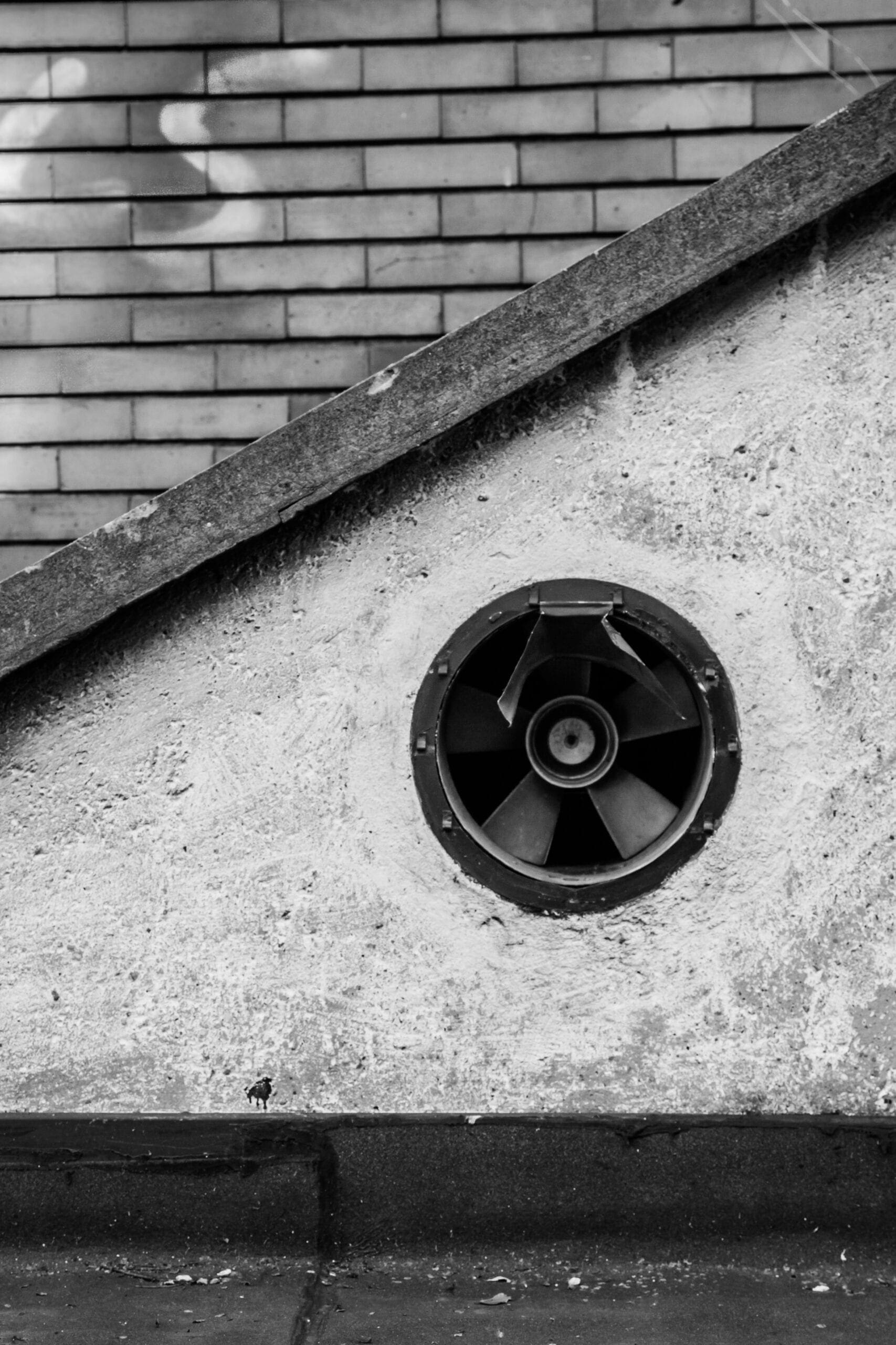 black 5 spoke wheel on concrete wall hvac contractor system