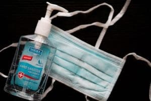 Are Masks Here To Stay As A Fashion Statement? 1 blue hand sanitizer pump bottle with mask