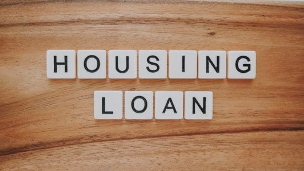 housing loan blocks on brown wooden surface