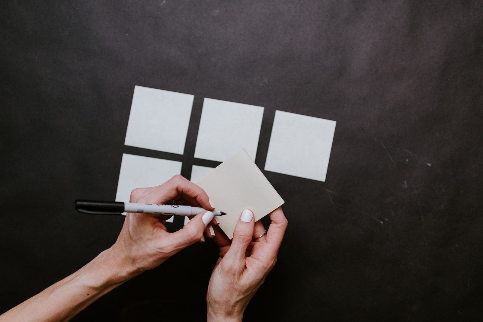 person holding white printer paper