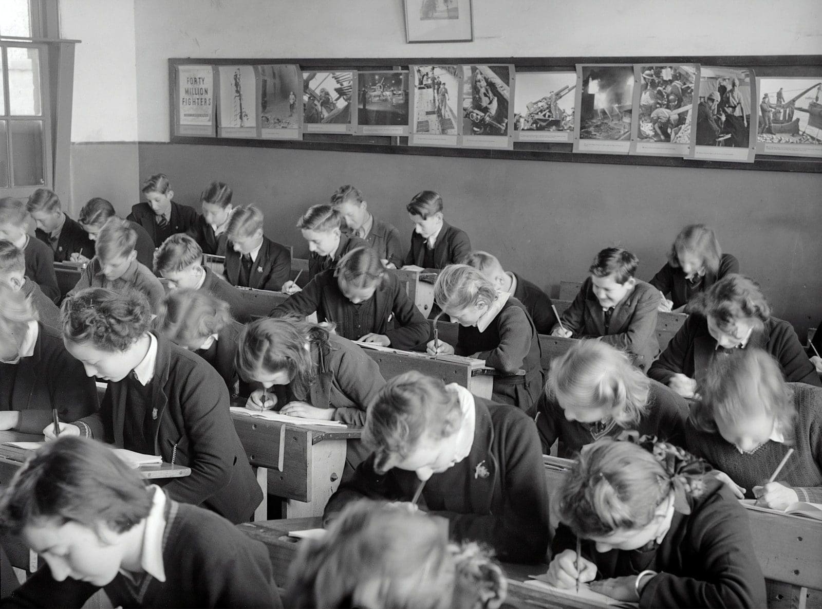 Exam day grayscale photo of people sitting on chair