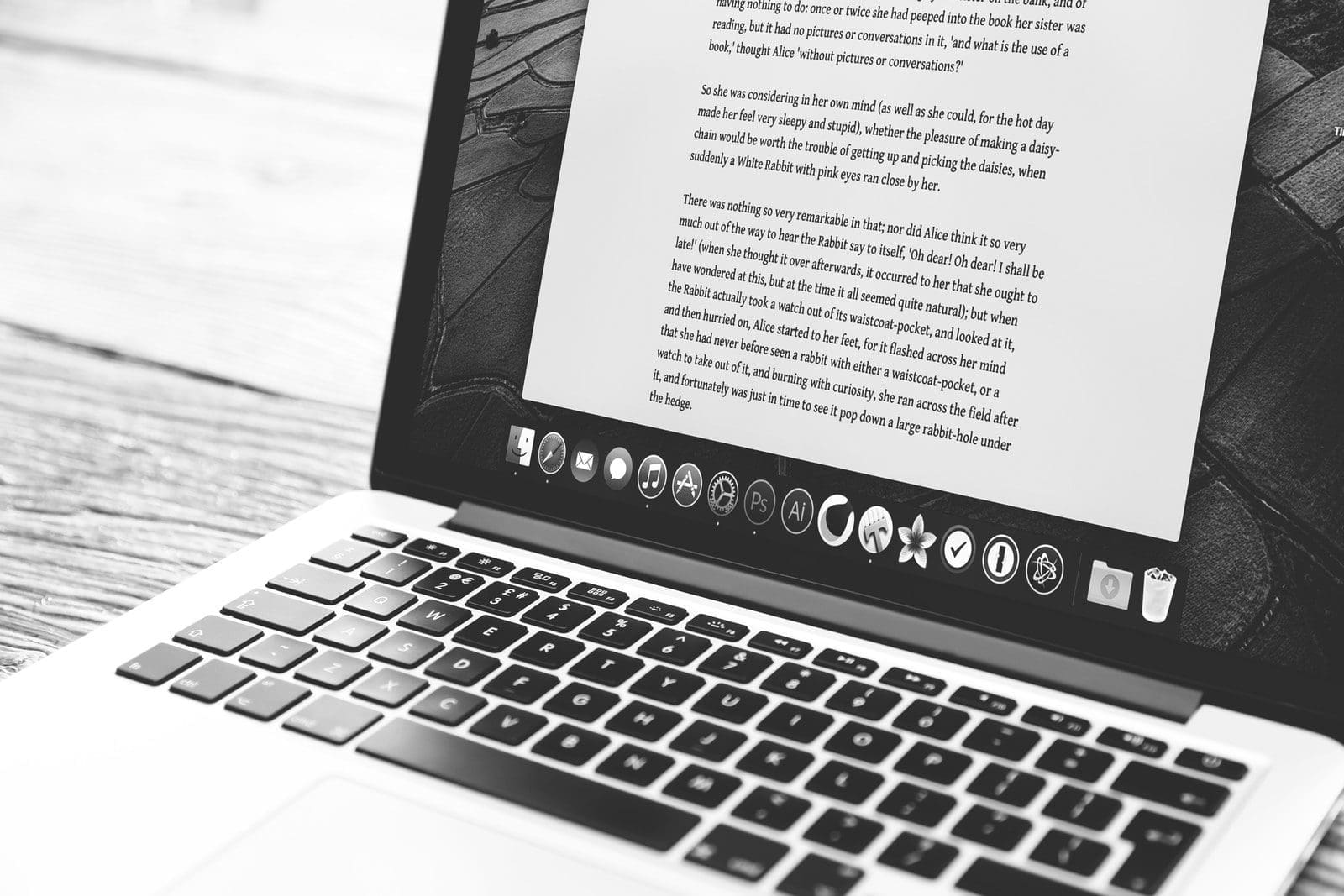 writing an essay on silver MacBook showing application