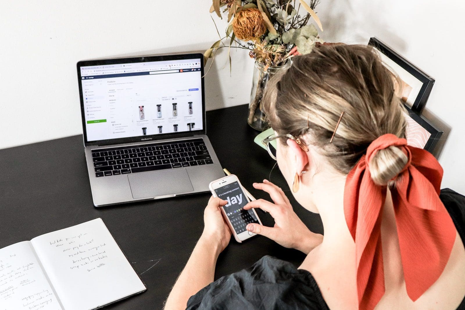 ecommerce website woman in orange shirt using iphone