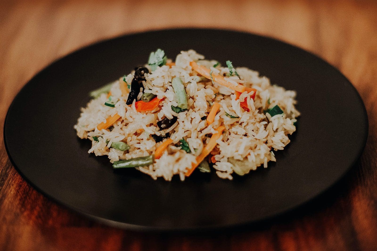 white cook rice on black plate