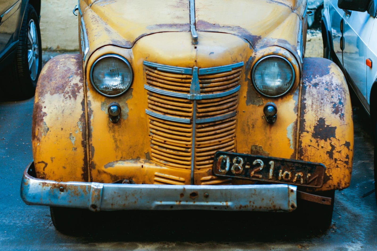 corrosion-proof yellow vintage car with white and black eyes