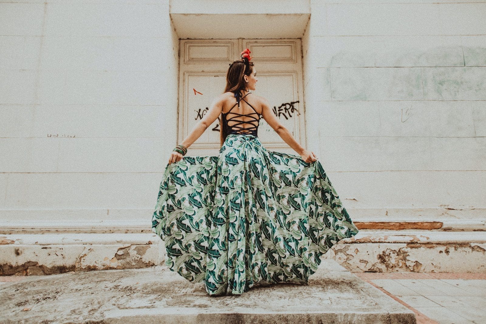 woman in green and white floral tube dress