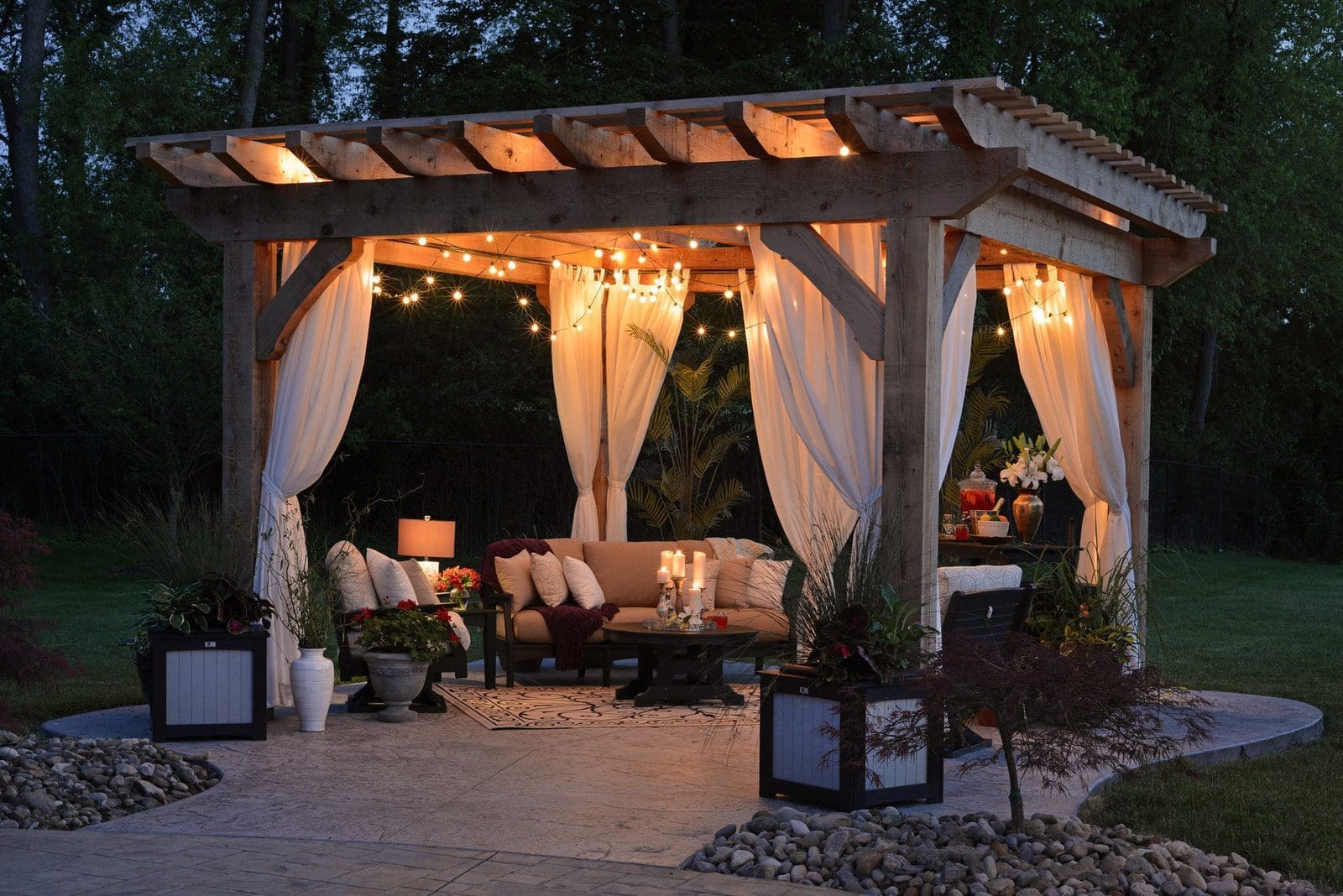 beautiful backyard photo of gazebo with curtain and string lights