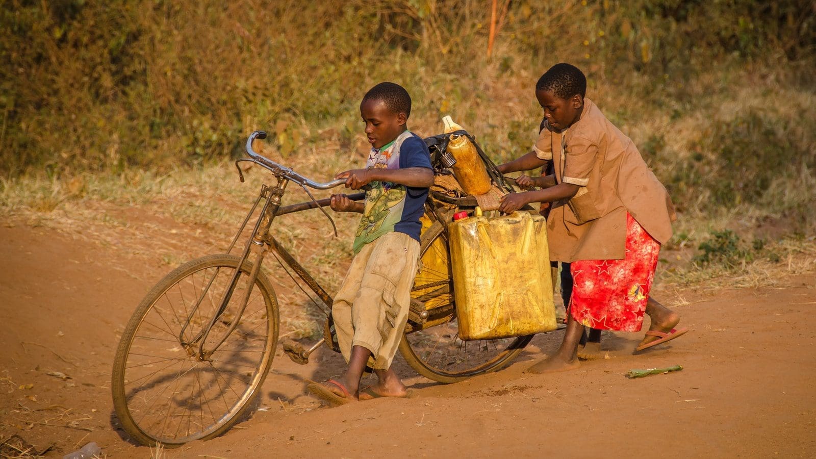 blockchain marketplace water crisistwo kids using brown bike with cargo
