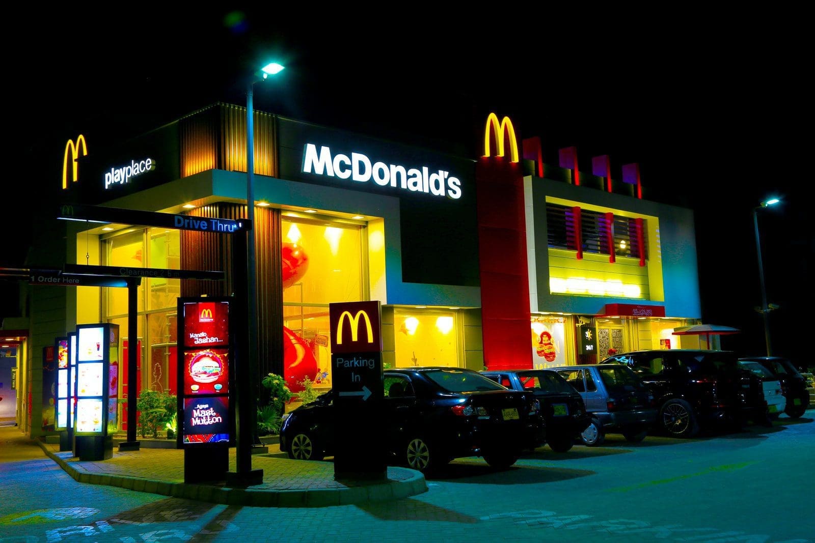 McDonald's cars parked in front of UNKs restaurant during night time