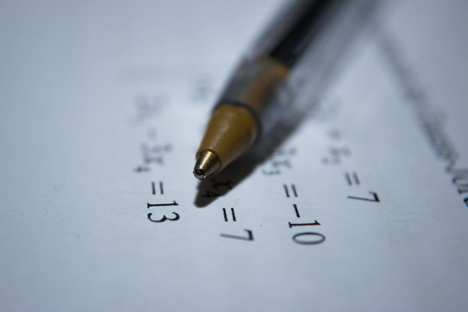 Photo by Antoine Dautry math olympiad black retractable pen on white printer paper