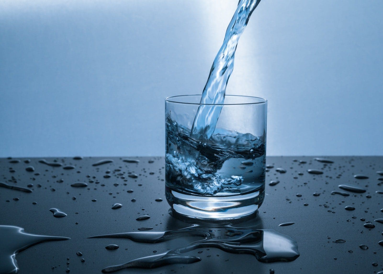 alkaline ionized Fluid Pouring in Pint Glass