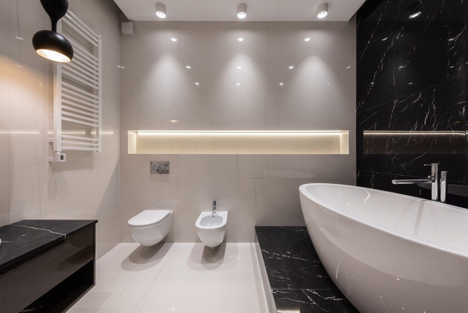 Bathroom interior with white and black tile