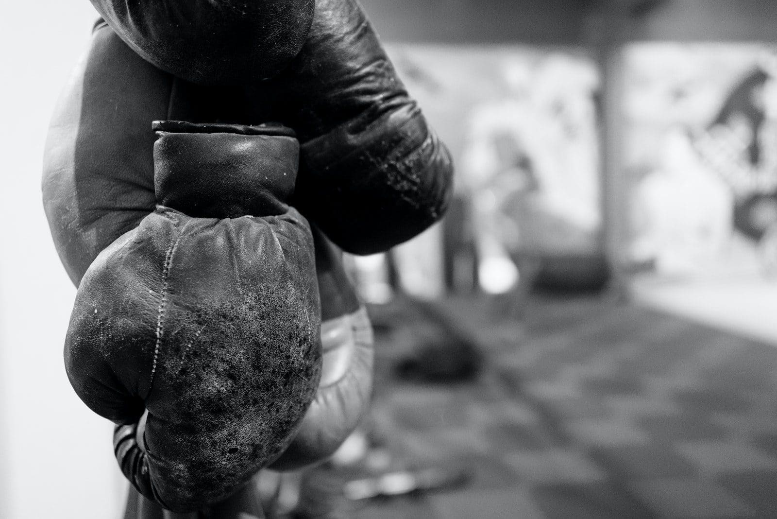 Grayscale Photo of Boxing Gloves