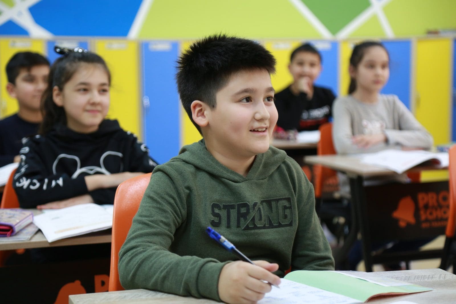 ncert solutions boy in gray long sleeve shirt holding pen