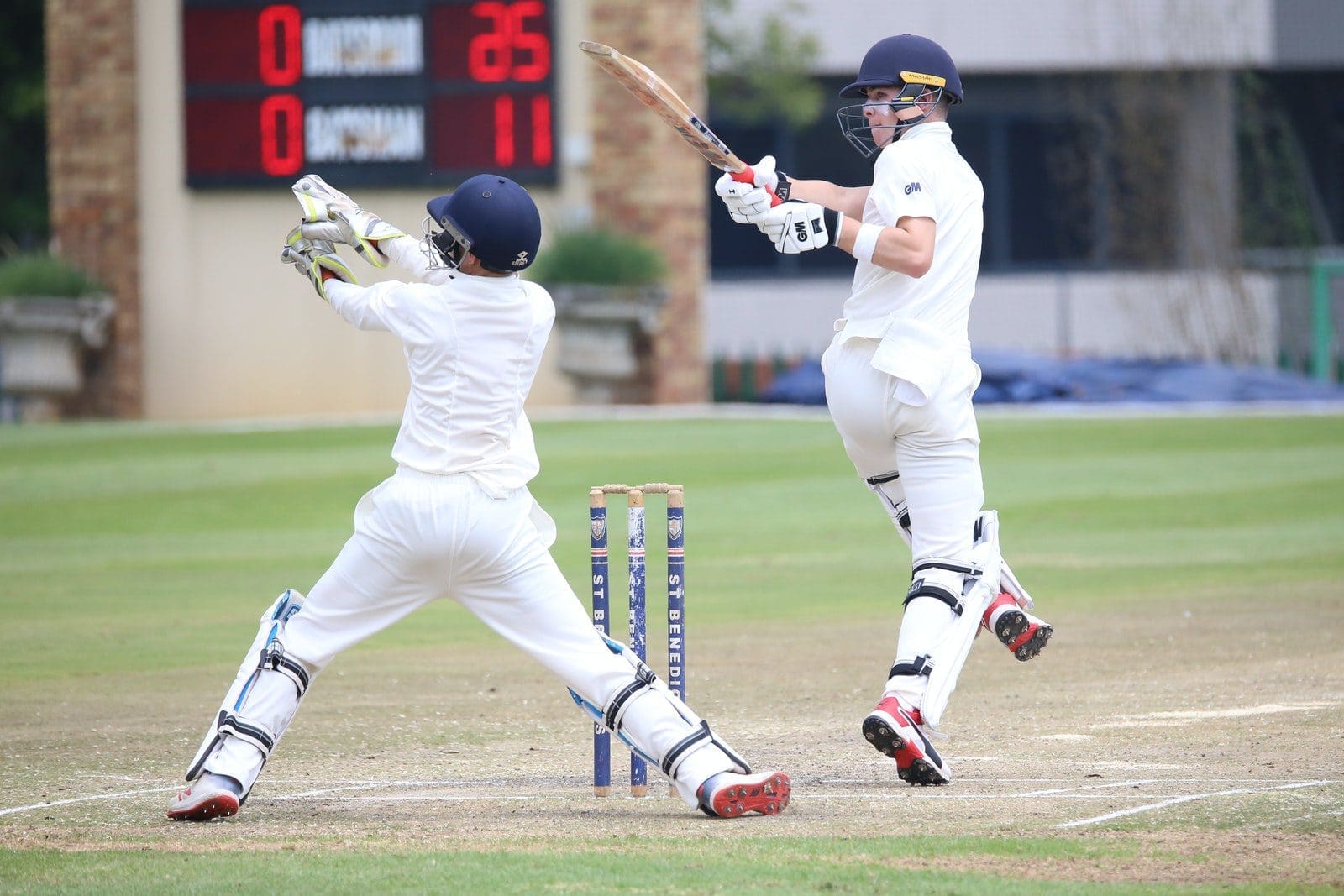 Photo by Patrick Case Men Playing Cricket