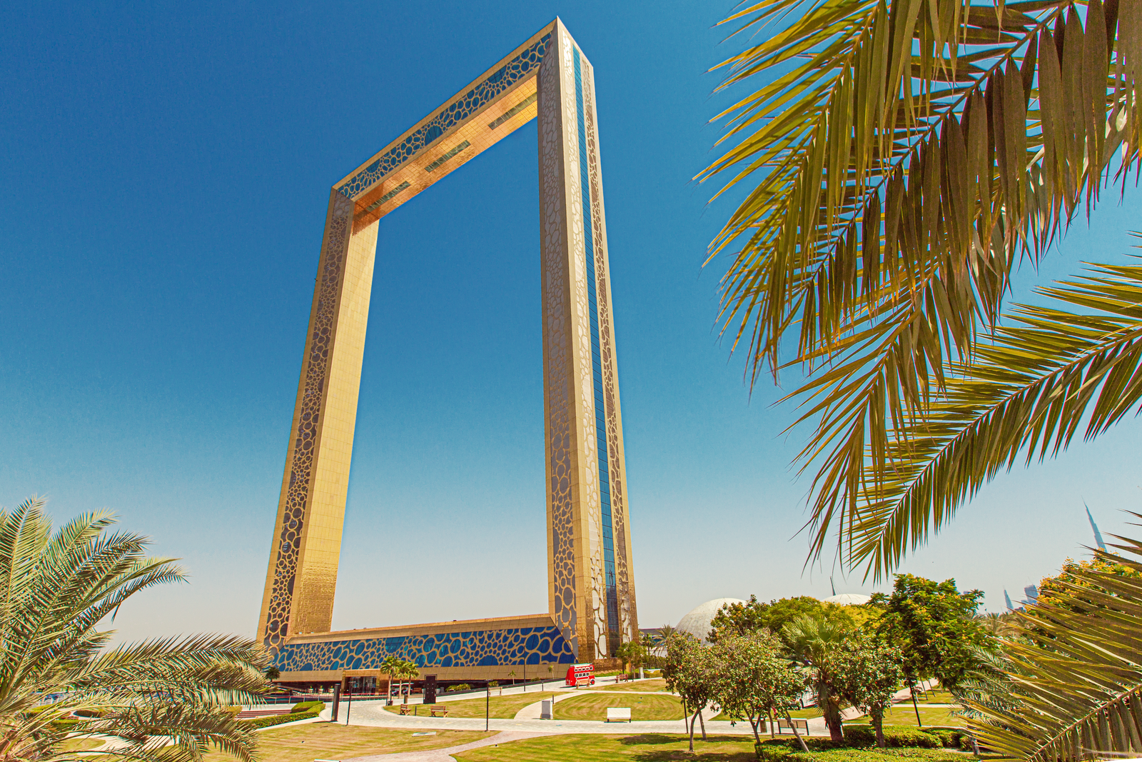 Dubai Frame People Walking on Sidewalk Near Palm Trees