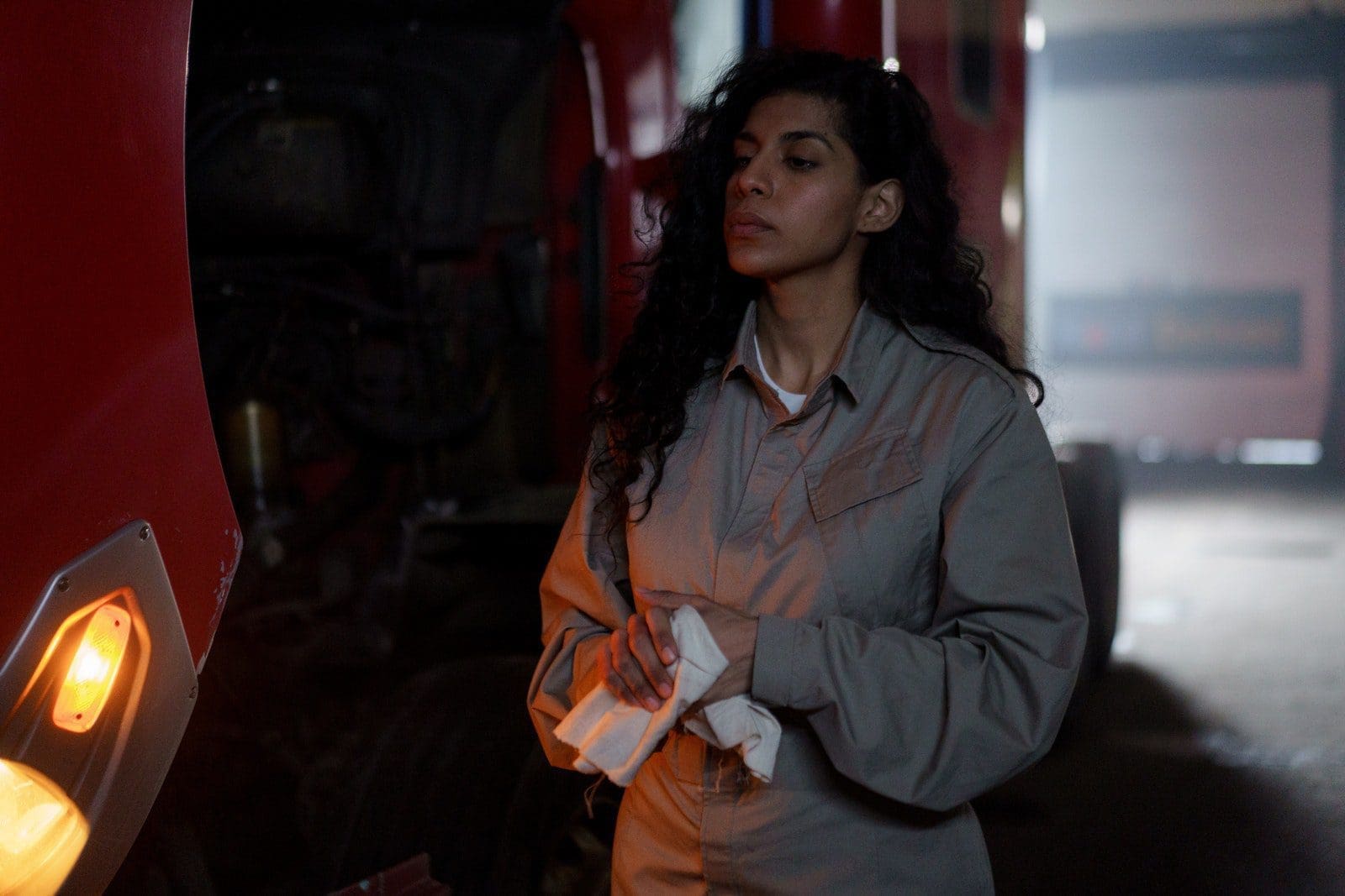 workwear Woman In Gray Coverall Standing Beside A Vehicle
