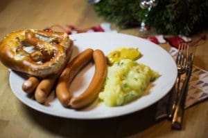 traditional christmas dinner germany sausages potato salad home 134448230