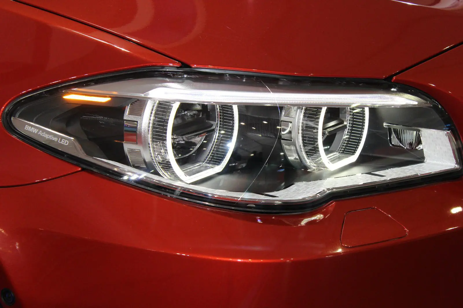 aftermarket headlights red and silver car engine