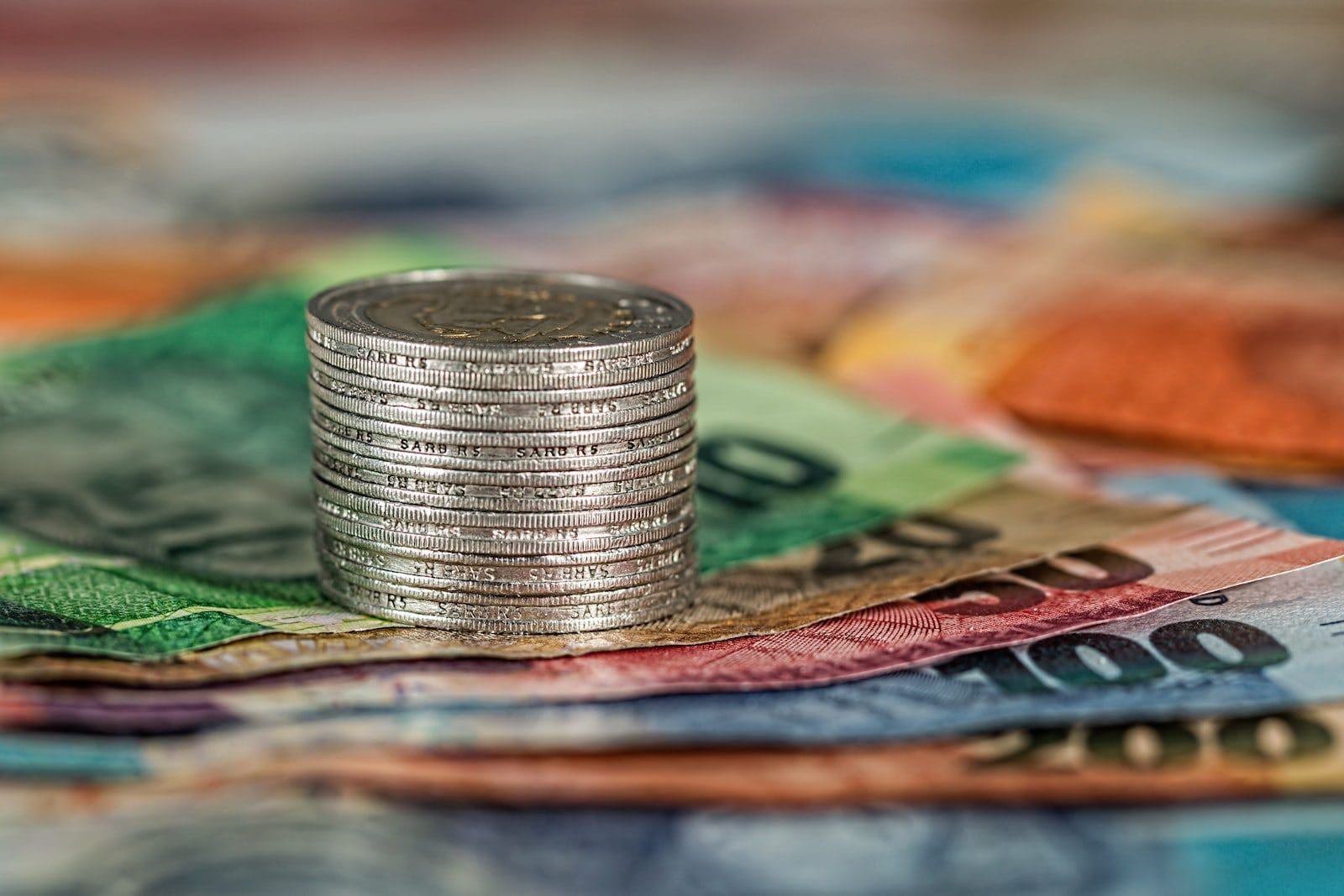 lifetime income Assorted Banknotes and Round Silver-colored Coins