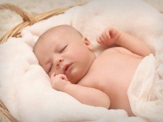 Baby Sleeping on White Cotton of new parent
