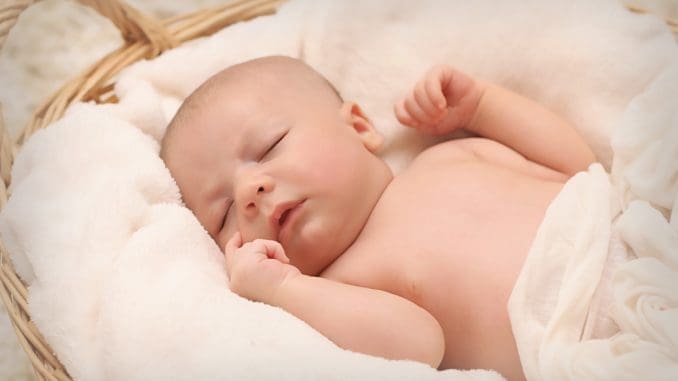 Baby Sleeping on White Cotton of new parent