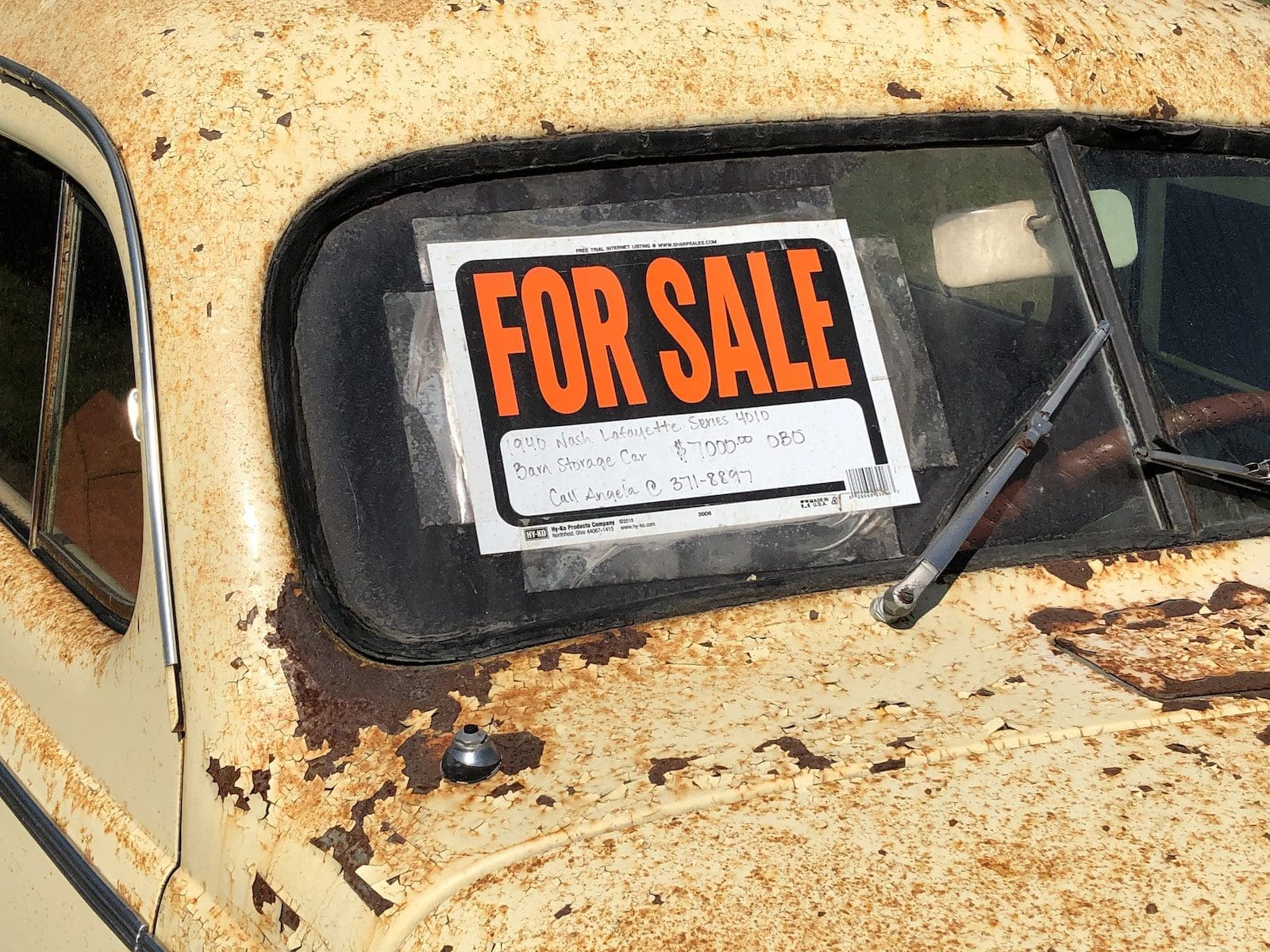 a rusted out car with a for sale sign on it how to sell your car