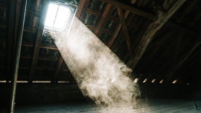 Photo by Mika Baumeister view of sun's ray at the attic venting
